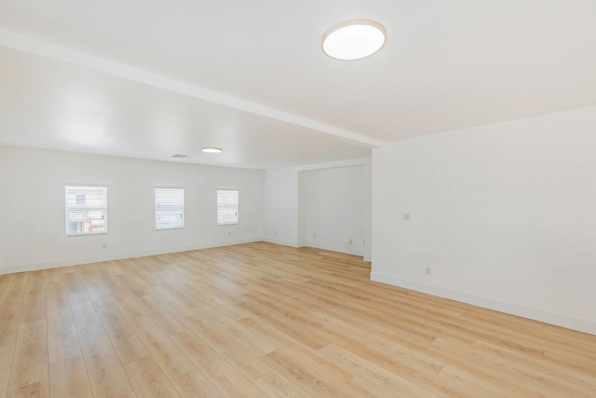 Wide-plank wood-look flooring in an open Las Vegas living space