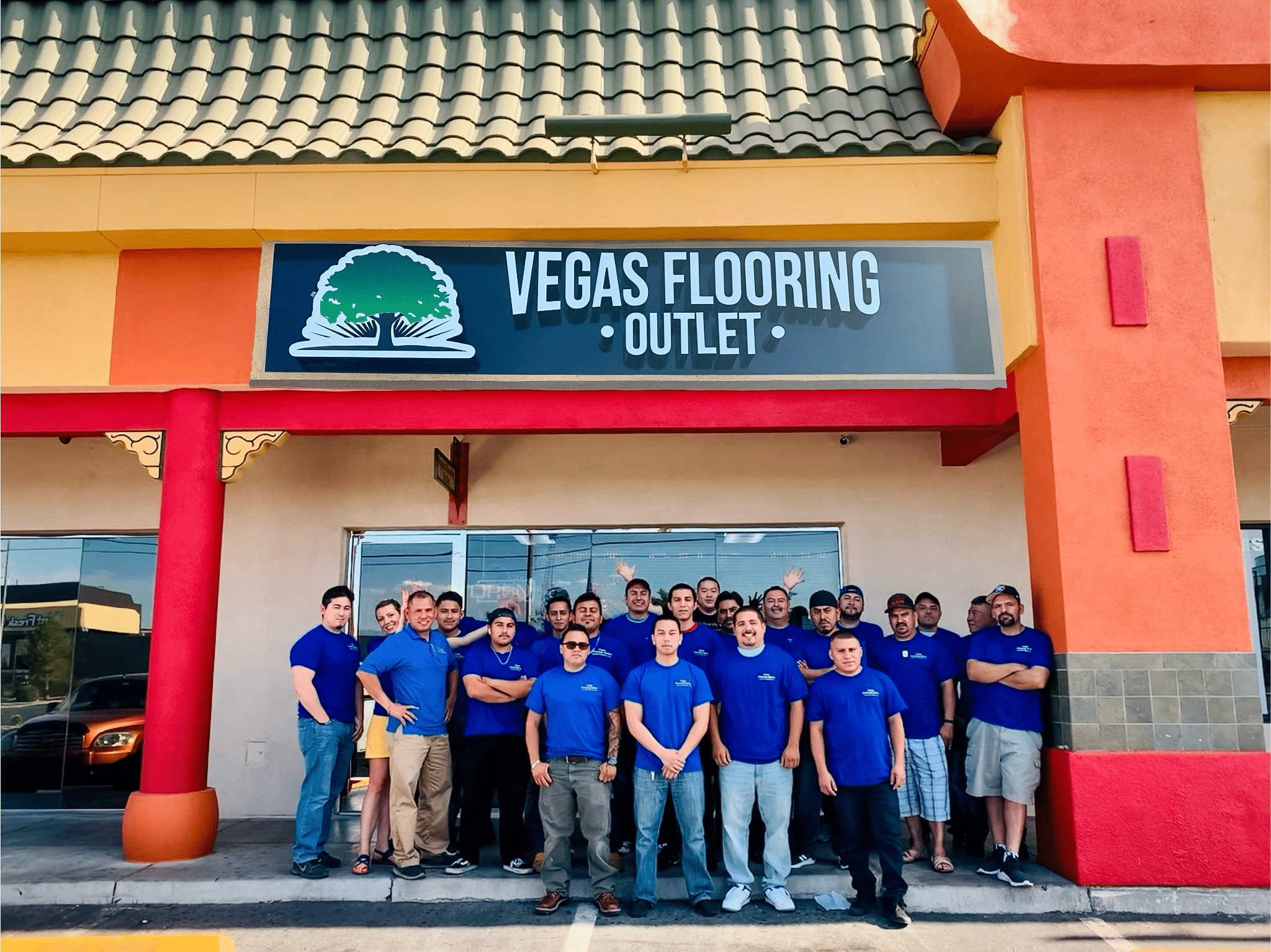 An Employee Group Picture Of Vegas Flooring Outlet, A Company That Sells Vinyl, Tile, Carpet, Laminate